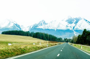 Road with panorama of High Tatra mountains clipart