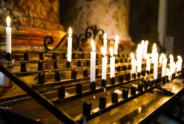 Stock image Burning candles in a church