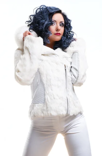 Beautiful brunette in white fur coat — Stock Photo, Image
