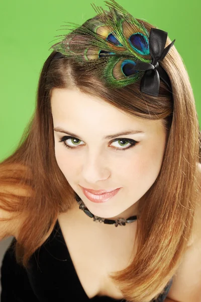 Woman with peacock feathers — Stock Photo, Image