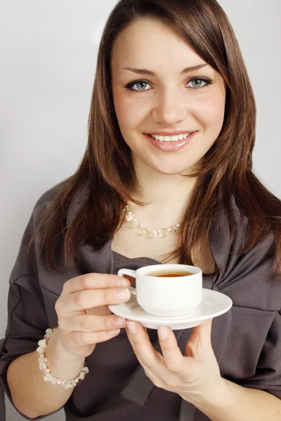 Woman holds cup — Stock Photo, Image