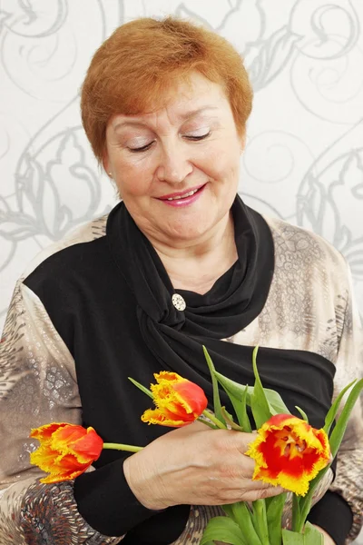 Stock image Lady with tulips