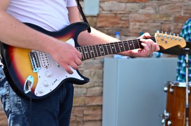 Man playing guitar closeup clipart
