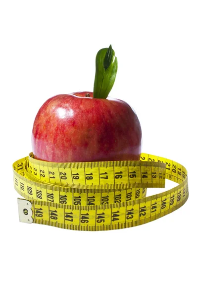 Red apple with yellow measuring tape — Stock Photo, Image