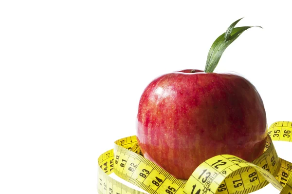 Conceito de dieta - maçã vermelha e fita métrica — Fotografia de Stock