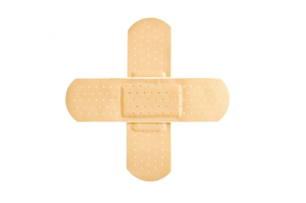 胶粘剂-急救绷带在十字架形状 — 图库照片