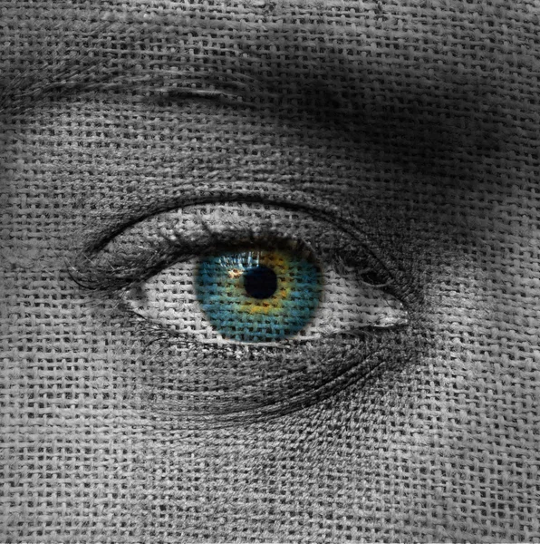 Блакитне око на візерунку полотна — стокове фото