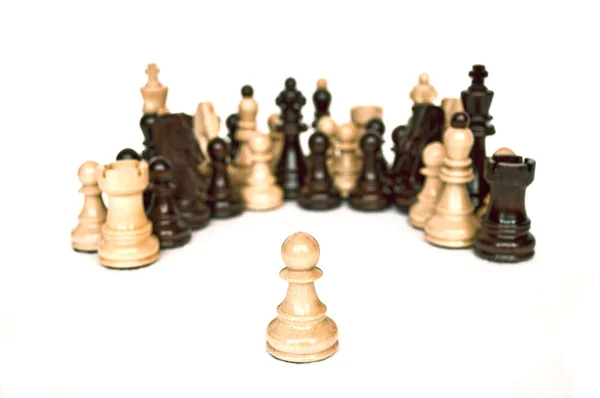White pawn against all isolated on white — Stock Photo, Image