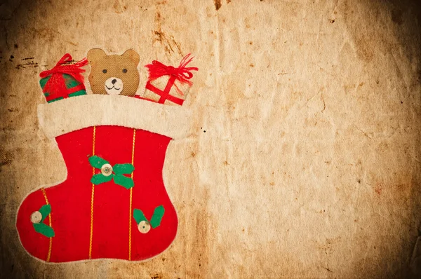 Ročník vánoční pohlednice s vánoční ponožka a Medvídek — Stock fotografie