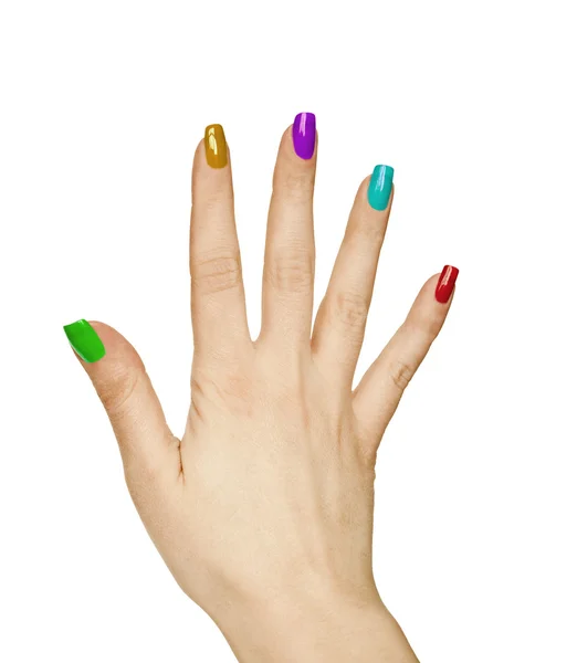 Žena ruka s barevnou manikúrou — Stock fotografie
