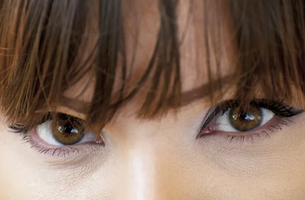 Olhos de mulher com macro tiro de maquilagem — Fotografia de Stock
