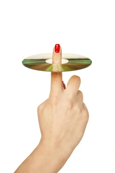 Женский палец, держащий компакт-диск изолирован на белом — стоковое фото