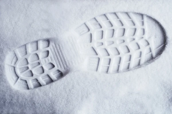 Lábfej nyomtatvány friss hóban — Stock Fotó