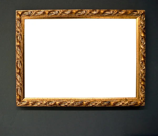 Lege gouden frame op grunge muur — Stockfoto