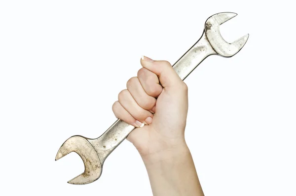 Woman hand holding spanner — Stock Photo, Image