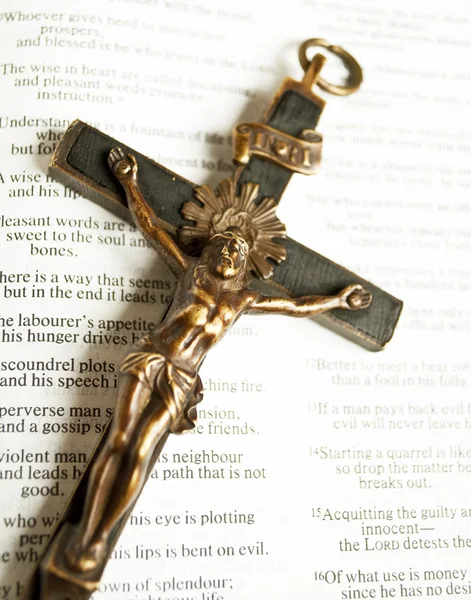 Cross with crucified Jesus Christ on open bible — Stock Photo, Image