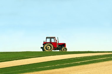 Tractor in a field clipart