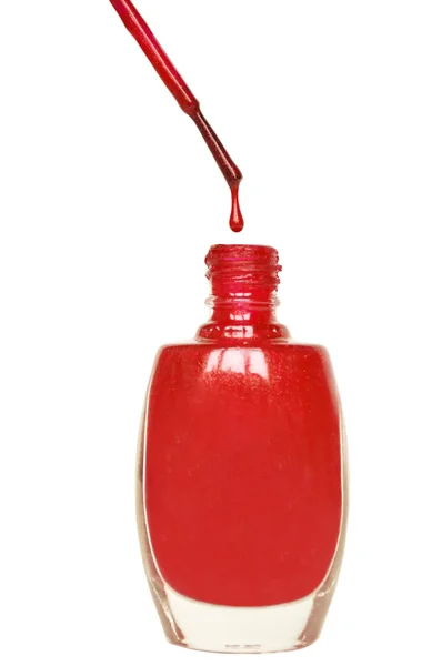 Red Nail polish dripping from brush — Stock Photo, Image