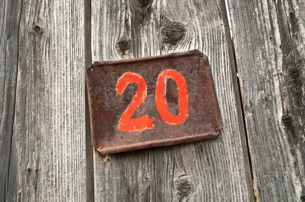 Number twenty on metal plate