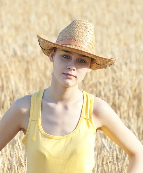 Cowgirl on wheat field — Stock Photo, Image