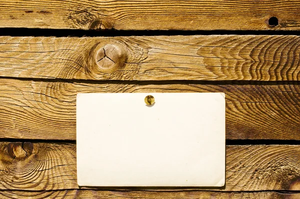 Empty grunge note paper on wood — Stock Photo, Image