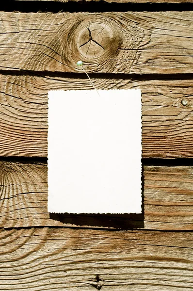 Grunge paper on wood plank — Stock Photo, Image