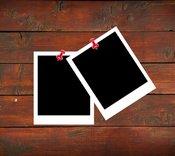 Blank photo papers on wooden background — Stock Photo, Image