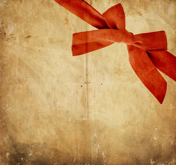 Vintage paper with red bow — Stock Photo, Image