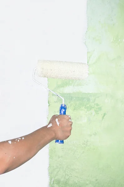 Hand painting on wall with roller — Stock Photo, Image