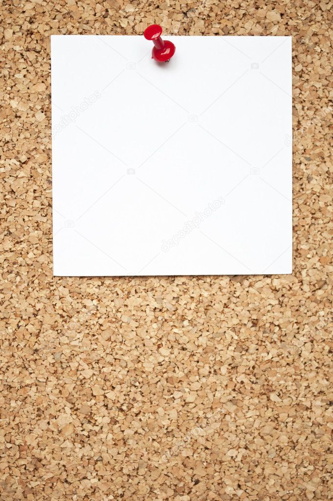 Blank notepad on cork board