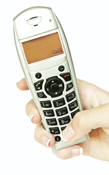 Telefoon in vrouw hand geïsoleerd op witte achtergrond — Stockfoto