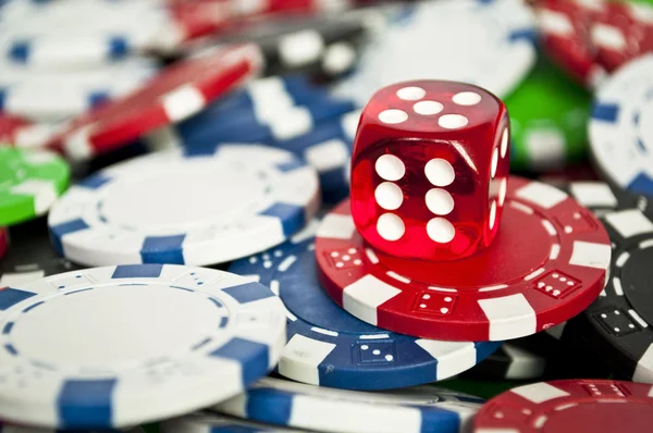 Red dice on chips close up — Stock Photo, Image