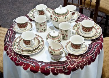 Tea set - pottery on table clipart