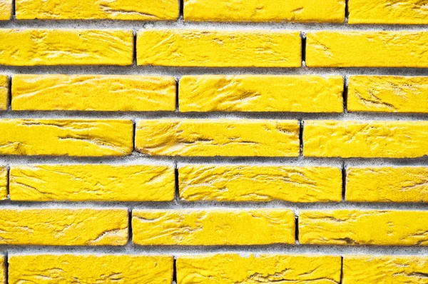 Gele bakstenen muur close-up — Stockfoto