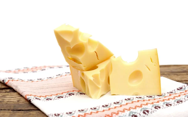Piece of cheese on a wooden table — Stock Photo, Image