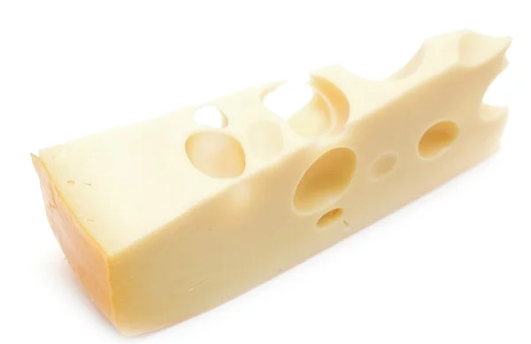 Pedazo de queso sobre un fondo blanco —  Fotos de Stock