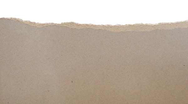 Papel rasgado - papelão cinza rasgado mostrando laye subjacente — Fotografia de Stock