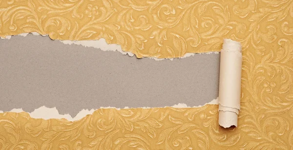 Torn gold paper background with texture and copy space for your — Stock Photo, Image