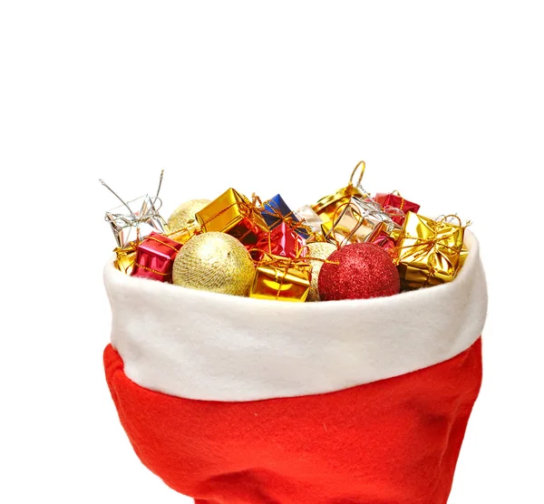 Санта Клауса капелюх з різдвяні подарунки — стокове фото