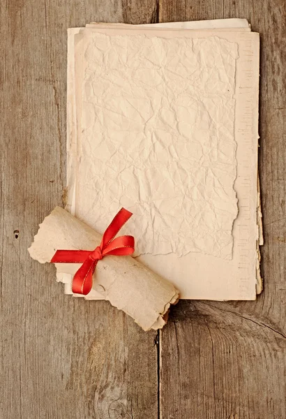 Old paper sheets with old paper roll — Stock Photo, Image