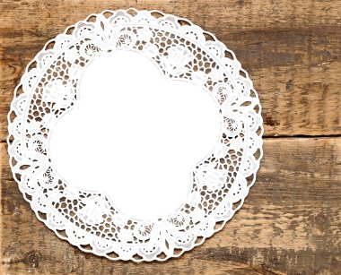 Vintage lace over wooden background with space for your text clipart