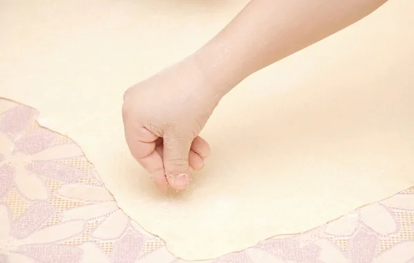 stock image Child's hands kneading dough