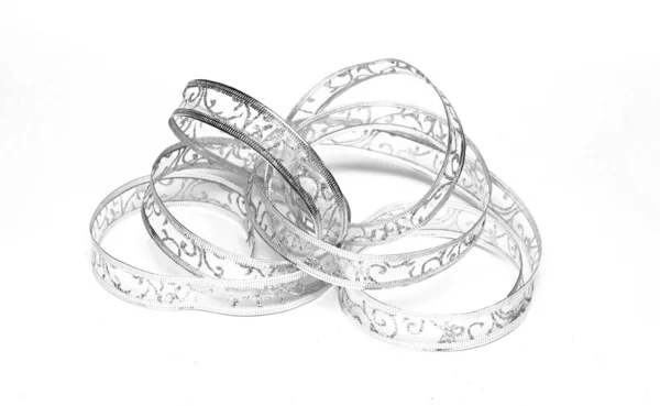 Silver ribbon serpentine on a white background — Stock Photo, Image