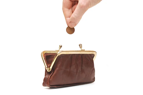 Hand kasta mynt i handväskan — Stockfoto
