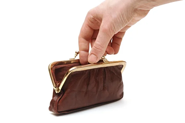 Hand throwing coin in purse — Stock Photo, Image