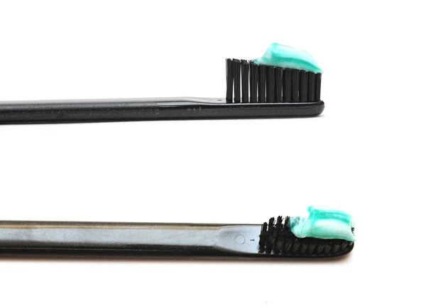 Close up toothbrushes over white background — Stock Photo, Image