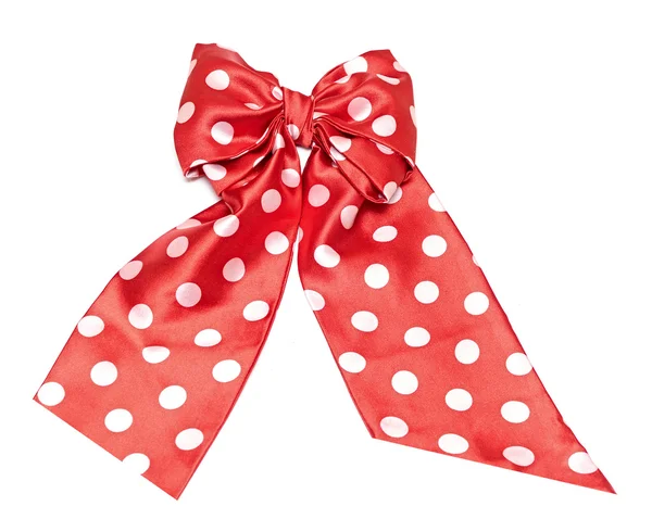 Dotted red satin gift bow and ribbon isolated on white — Stock Photo, Image