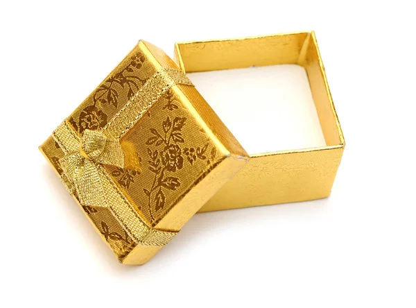 Öppna gyllene presentförpackning med gyllene band — Stockfoto