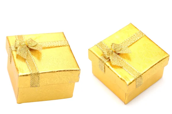 Golden gift boxes with golden ribbon — Stock Photo, Image