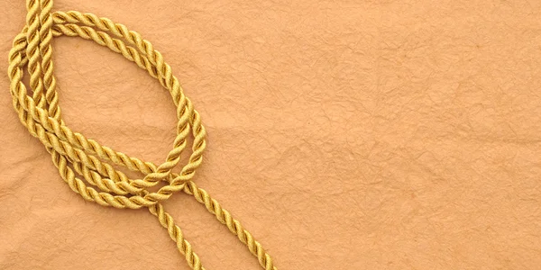 Винтажная бумага с декоративной веревкой — стоковое фото